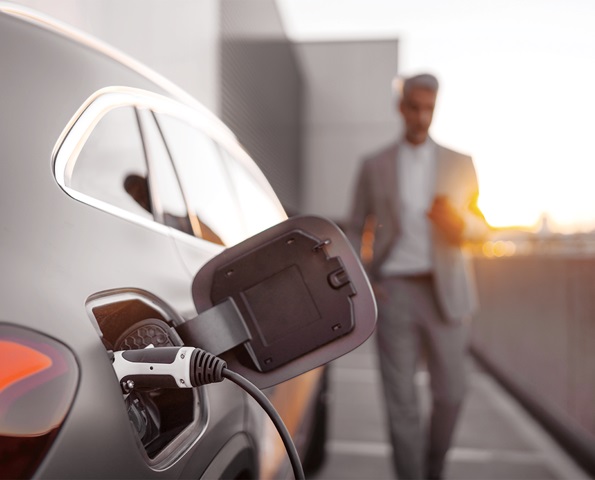 EV-charging-with-male-in-background EV-charging-with-male-in-background