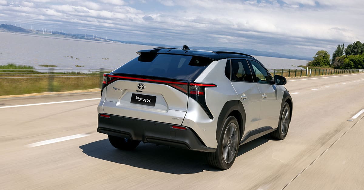 A 2020 Toyota HR-V driving along a scenic highway, showcasing its sleek design and dynamic performance.