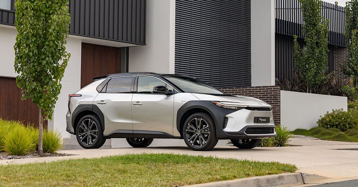 A 2021 Toyota HR-V parked in front of a residential house, showcasing its sleek design and modern features.