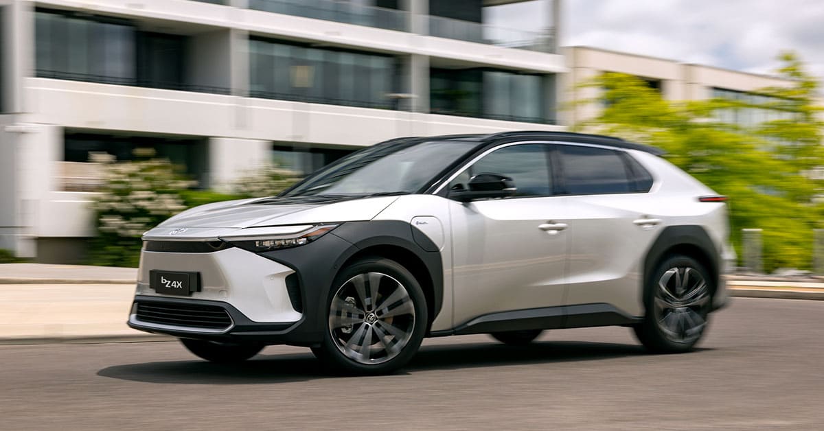 A 2021 Toyota Kona driving along a scenic road, showcasing its sleek design and dynamic performance.
