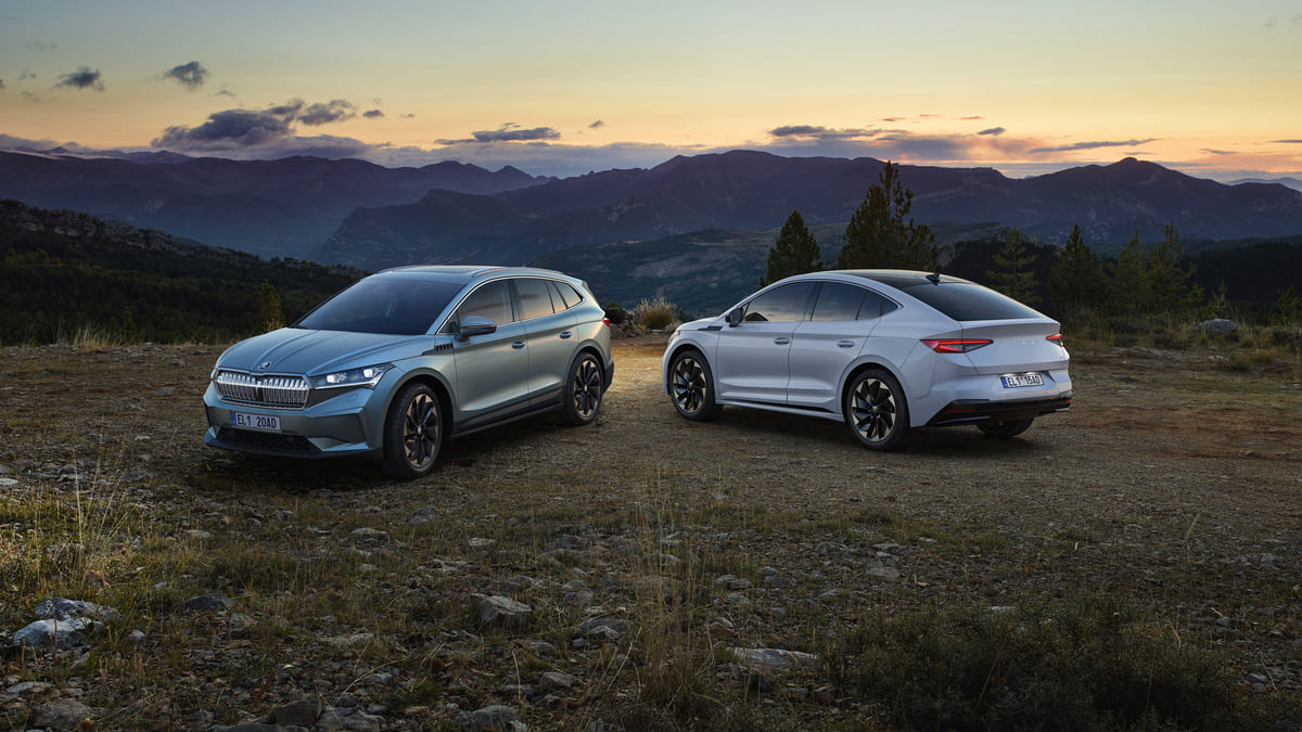 A new Chrysler SUV and another SUV parked on a scenic mountain landscape, showcasing their rugged design and adventure-ready appeal.