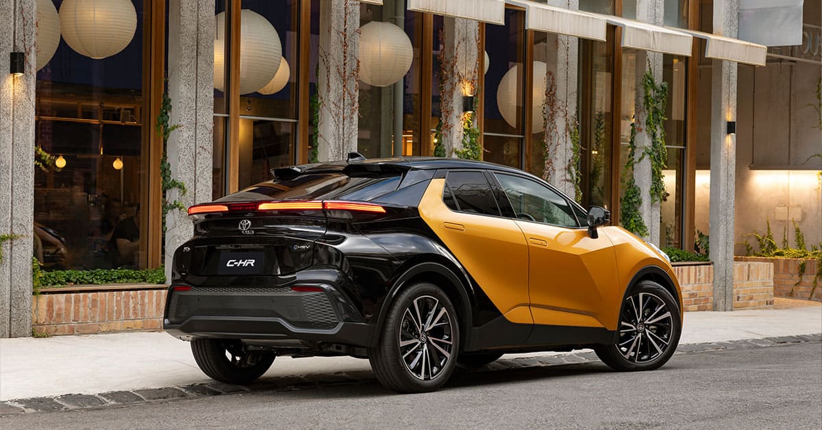 A new Toyota C-HR parked on the street, showcasing its modern design and sleek lines.