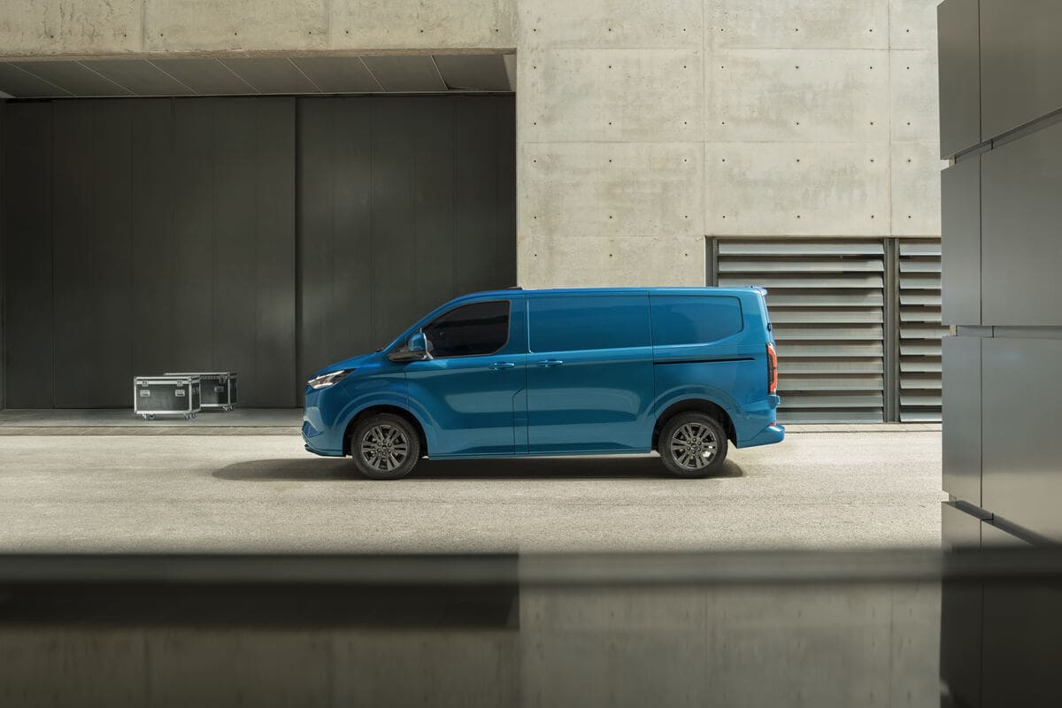 A new Toyota e-space van parked in front of a modern building, showcasing its sleek design and innovative features.