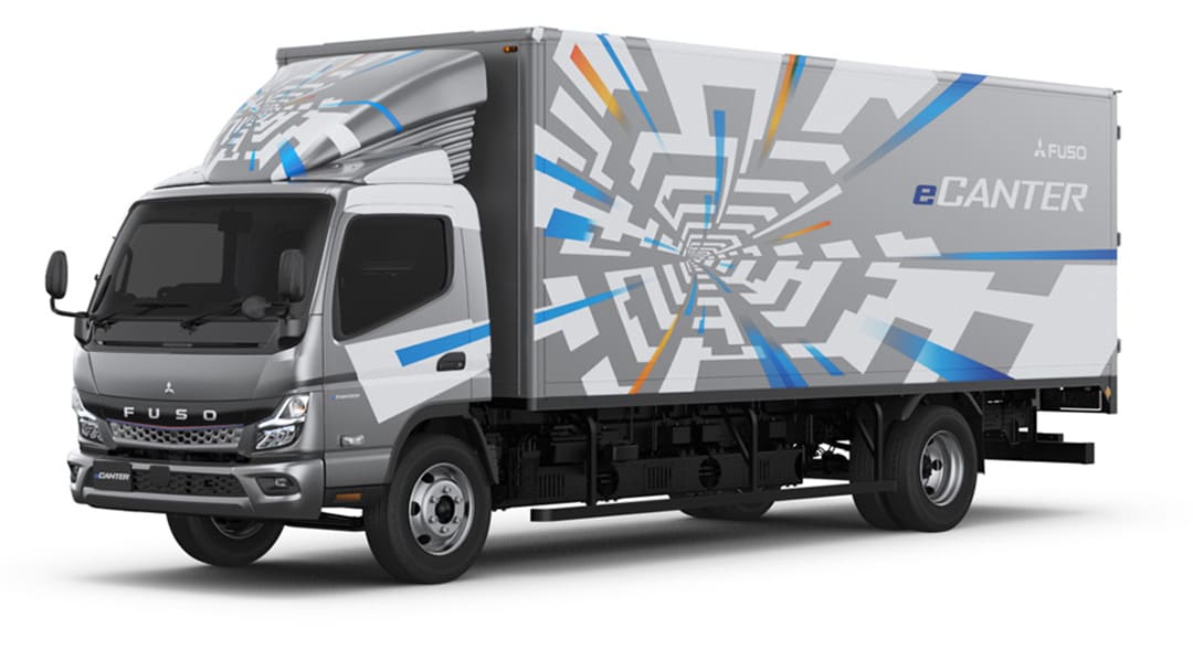 A truck featuring a colorful graphic design on its side, parked on a city street.