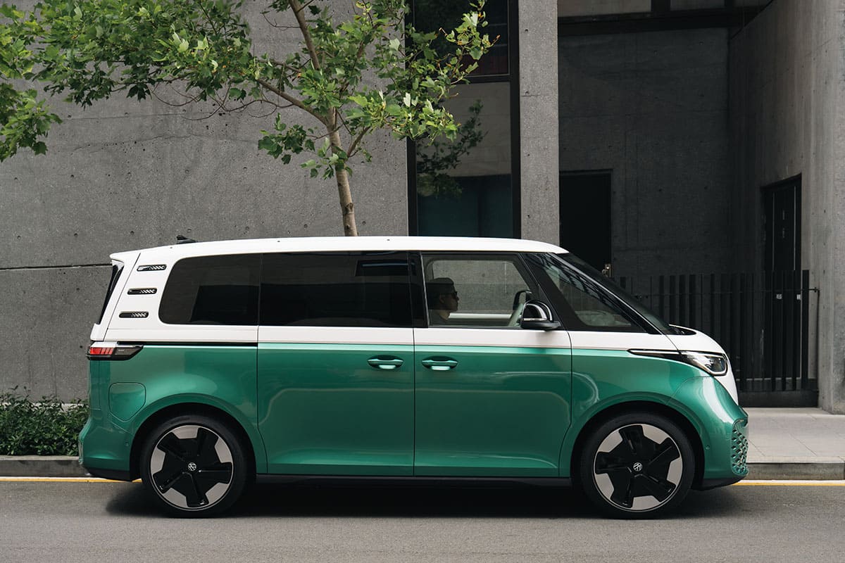 A Volkswagen e-GT parked on a city street, showcasing its sleek design and modern features.