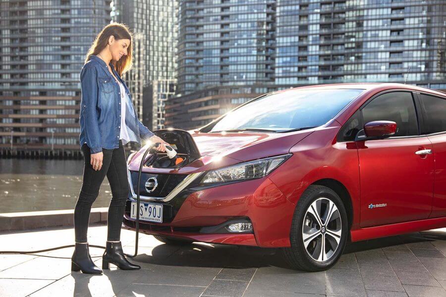Lady charging EV