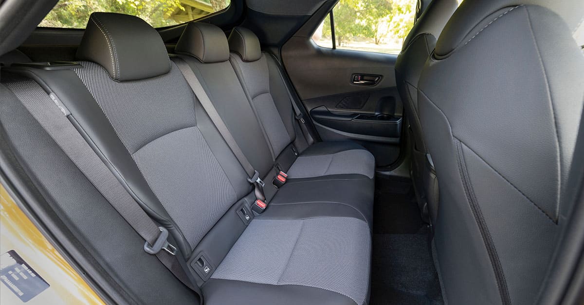 Back seats of a 2019 Toyota RAV4, showcasing spaciousness and modern design features for passenger comfort.
