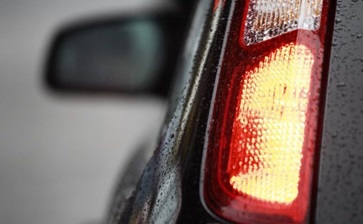 Close-up view of a car's tail light, showcasing its design and illumination features. globalblog'