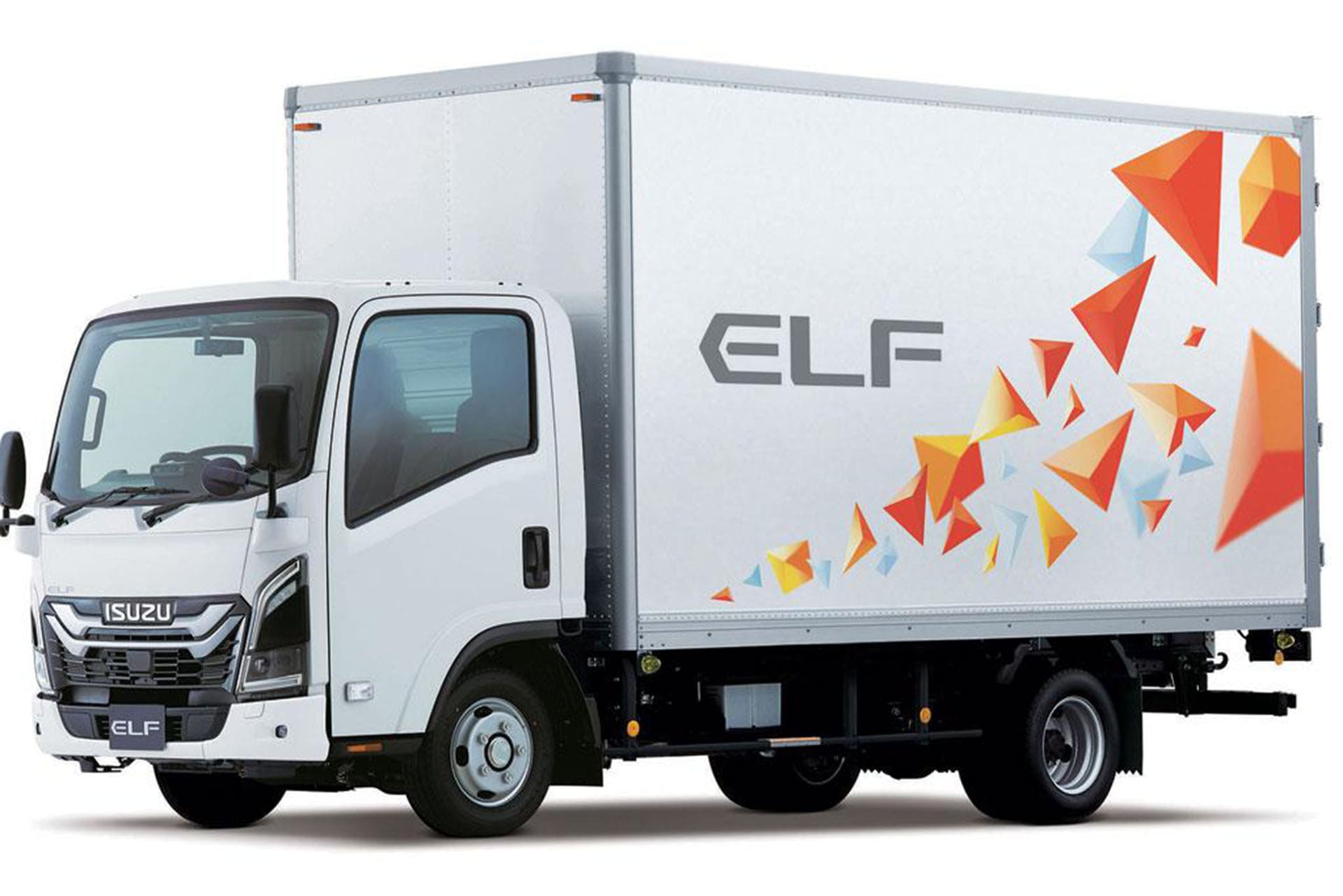 Isuzu Elf truck parked on a street, showcasing its compact design and commercial utility.