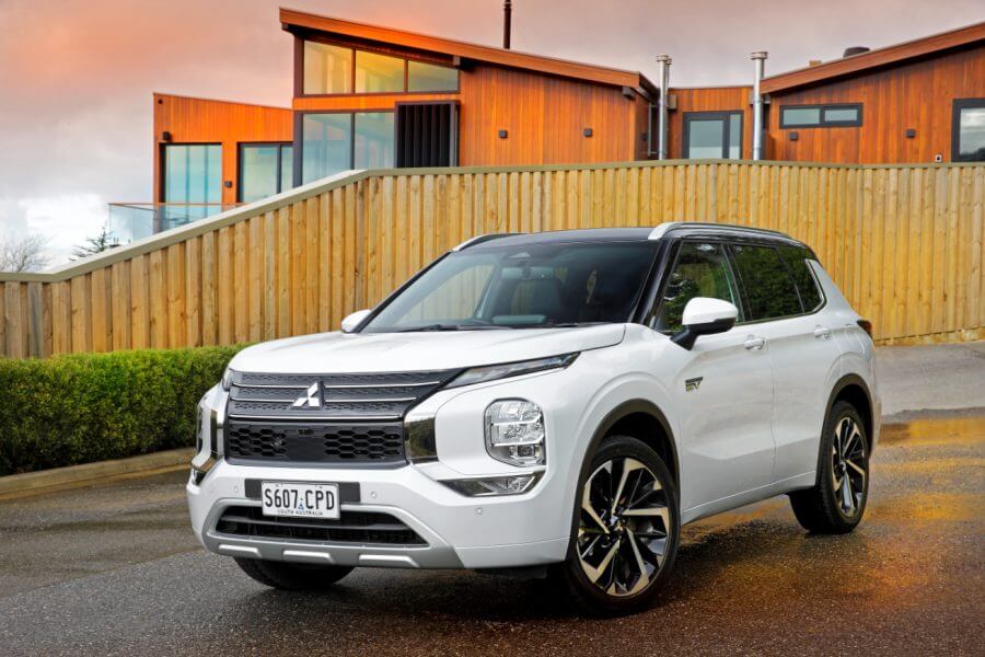 The car that can save you thousands- white car at home with sunset