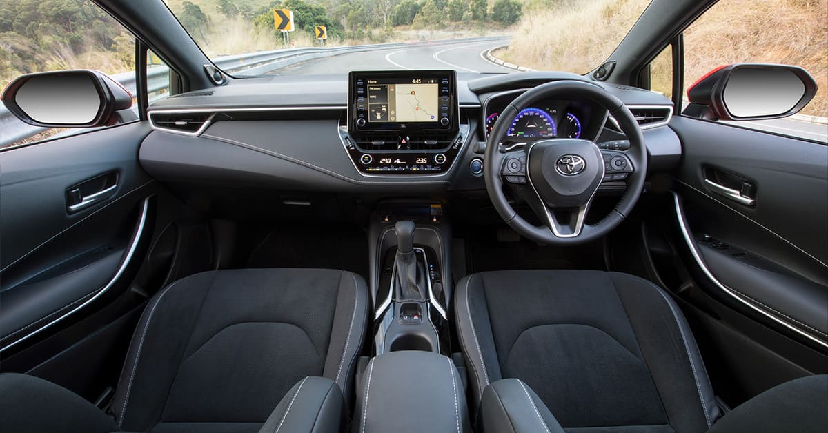 The interior of a 2019 Toyota Corolla featuring modern design, comfortable seating, and advanced technology.