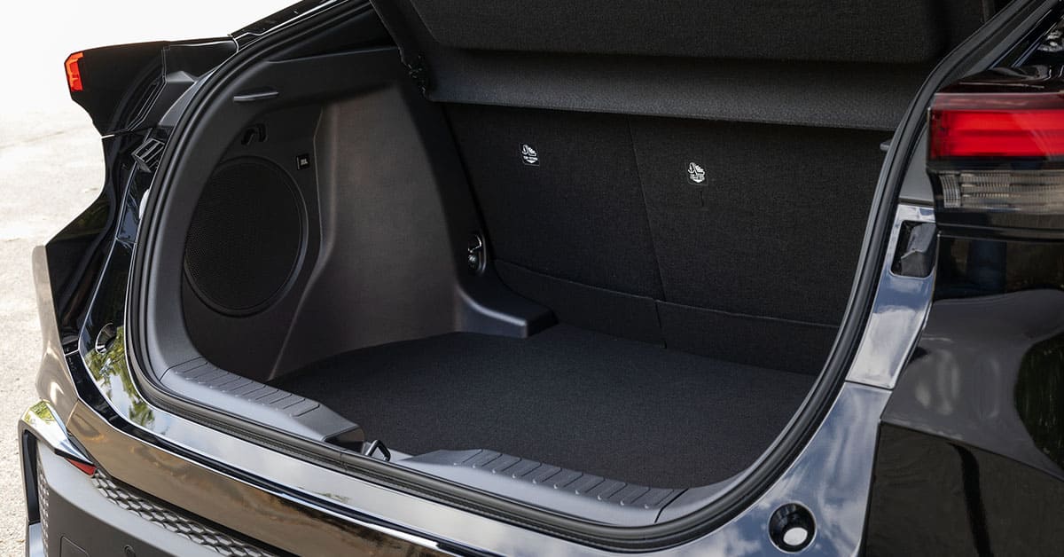 The open trunk of a black car, revealing its spacious interior and sleek design.
