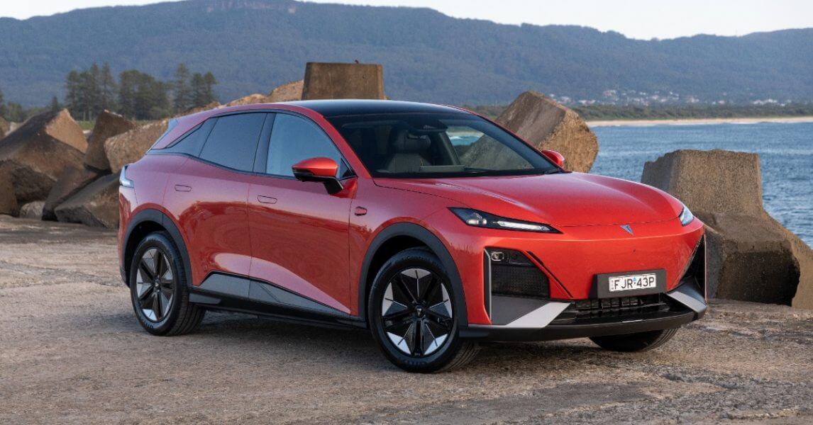 Vehicles coming to australia- red car on beach