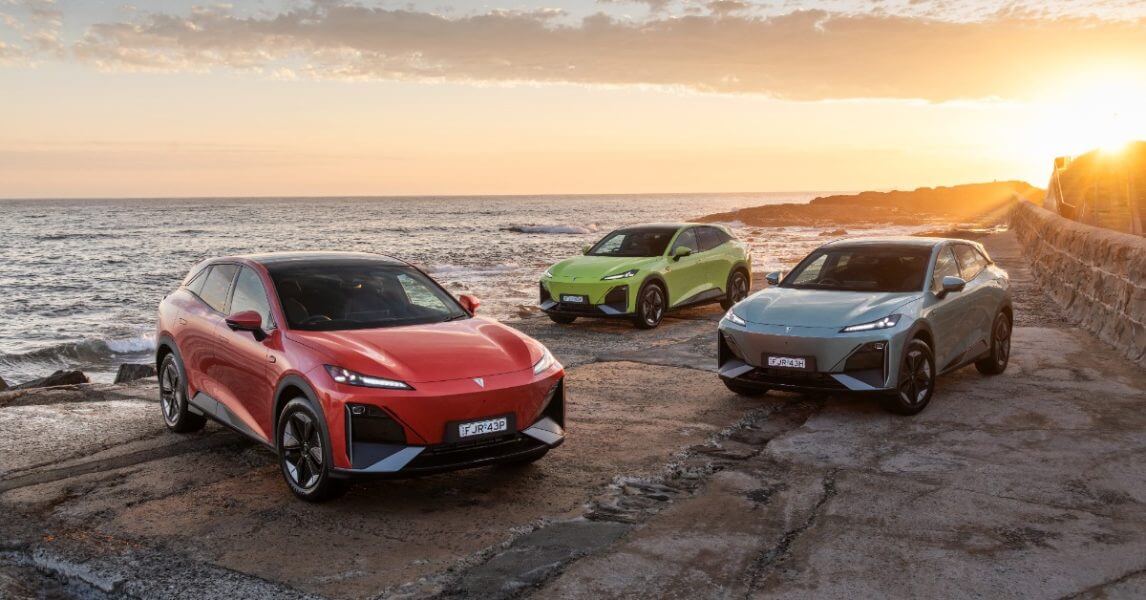 Vehicles coming to australia- red, green, and grey car