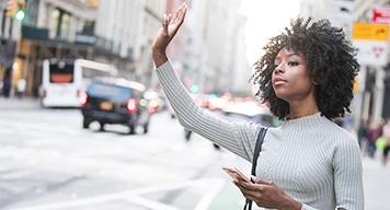 Woman-Waving-for-a-Taxi