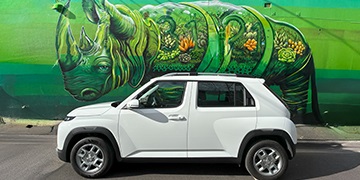 Hyundai INSTER Hyundai INSTER in white parked in front of an urban mural