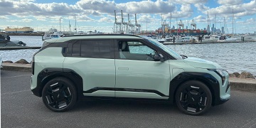 Kia EV3 GT-Line Kia EV3 car in Matcha Green parked in Williamstown VIC by the water.