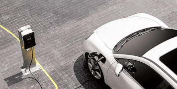 white-electric-vehicle-charging-in-parking-lot