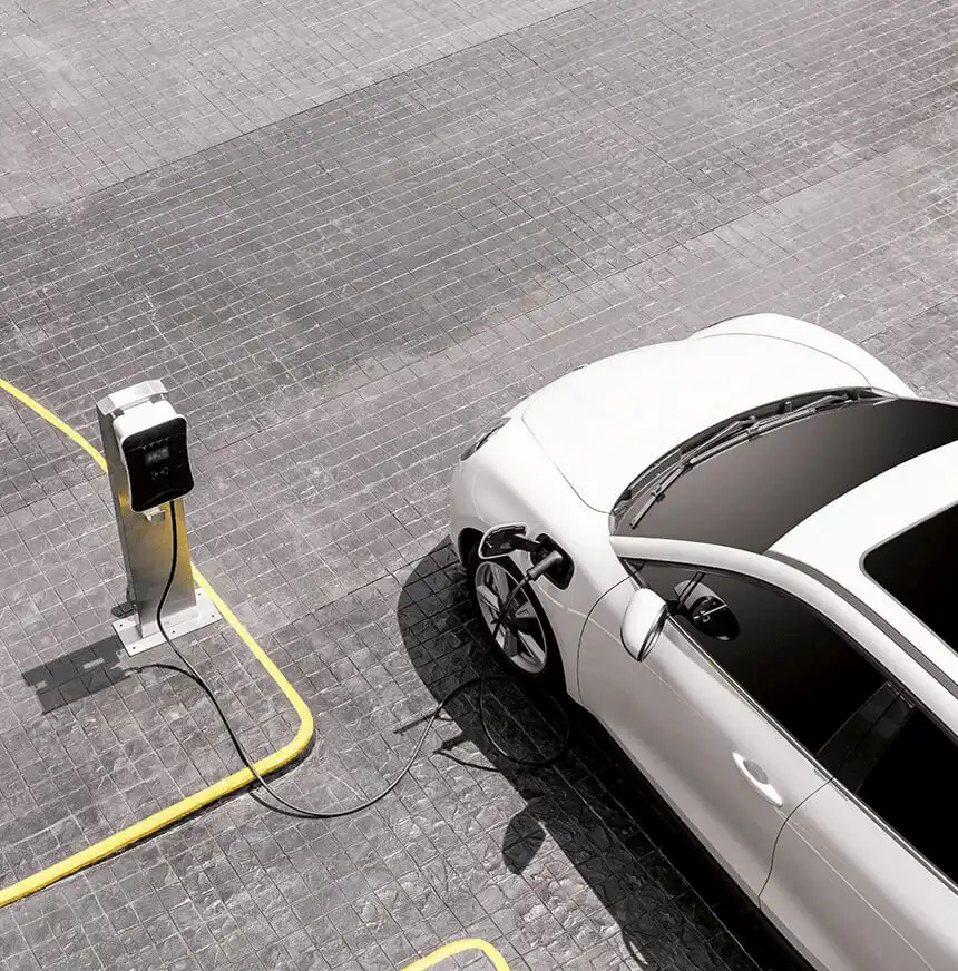 white-electric-vehicle-charging-in-parking-lot