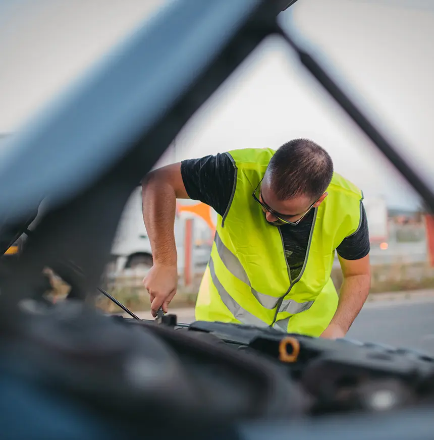 Man-repairing-car-on-road
