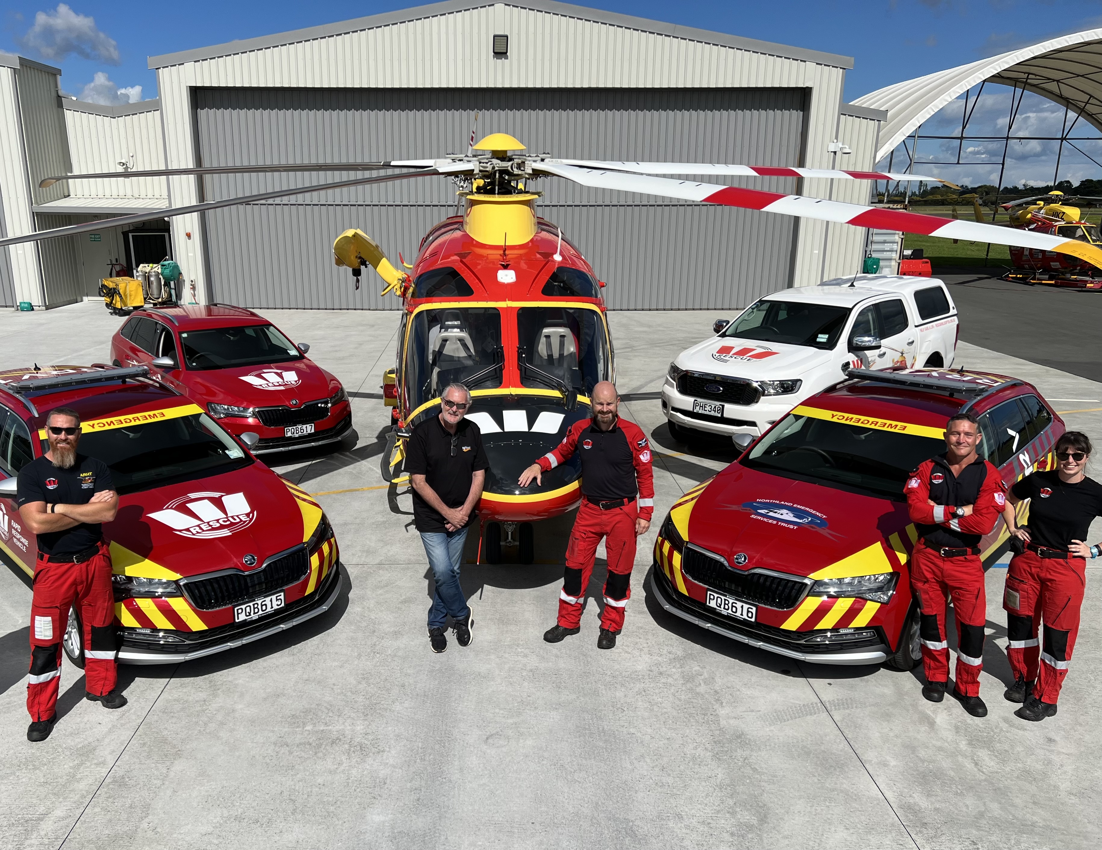 SG Fleet's Geoff Tipene (centre left) pictured with Auckland and Northland rescue helicopter crew and fleet of vehicles making a life-saving difference.  