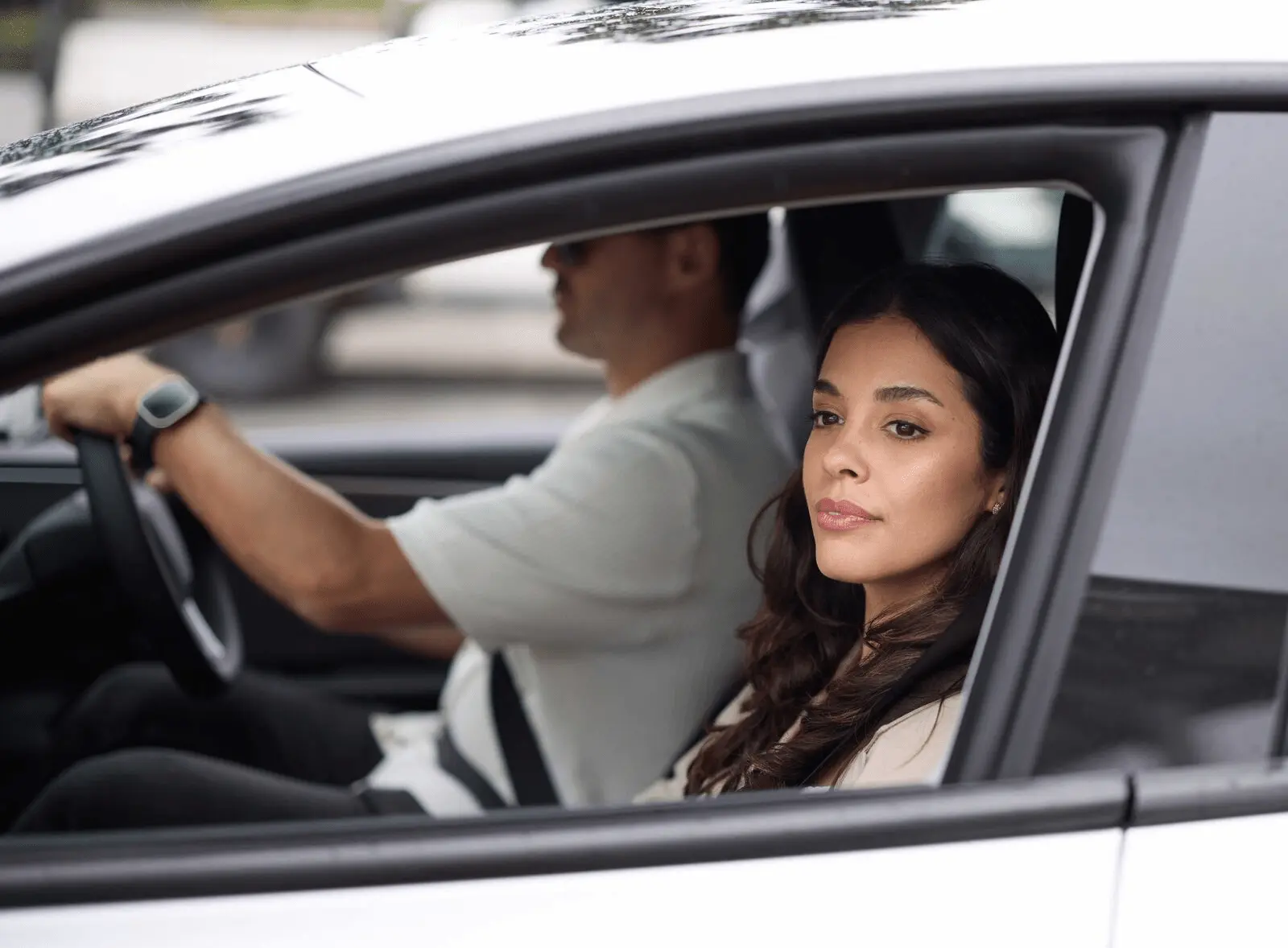 Two people driving in a vehicle