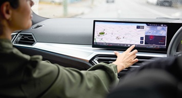 woman in a car - using touchscreen