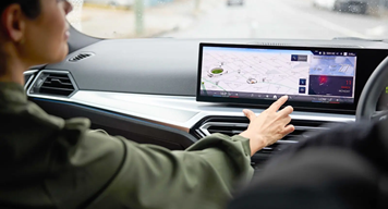 woman in a car - using touchscreen
