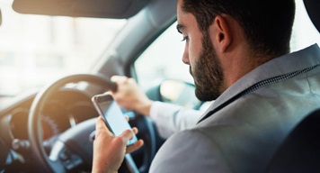 Road-safety-campaigns-are-we-getting-the-message Man driving while on phone