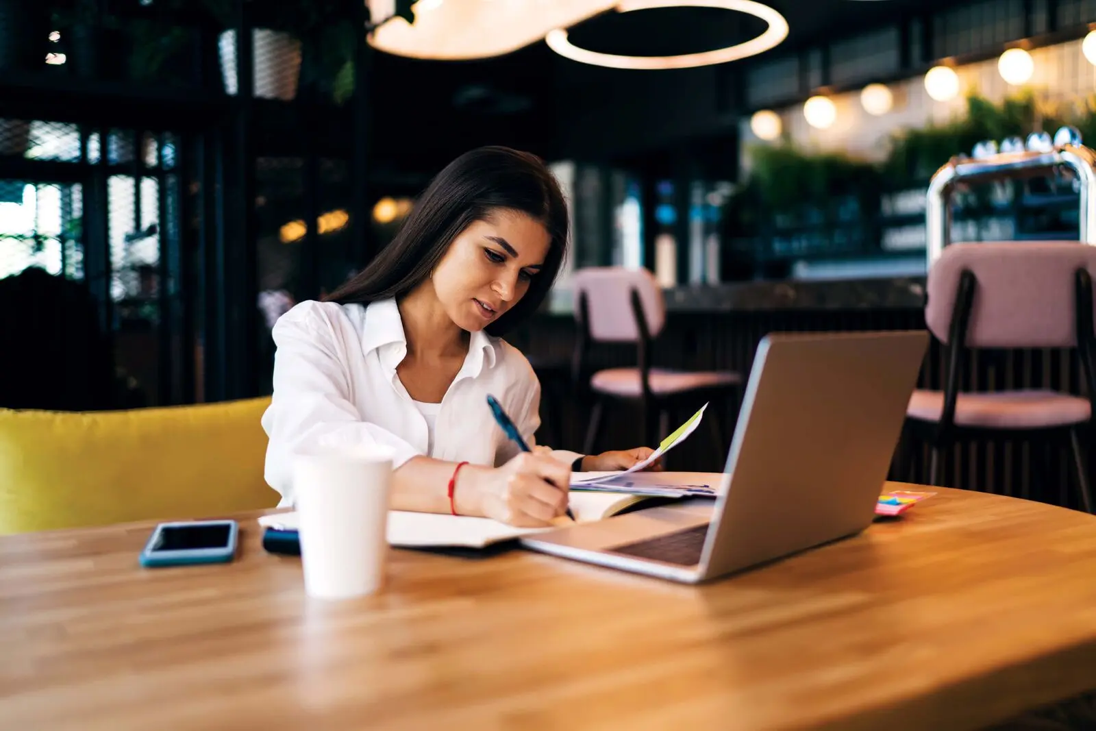 Kiwi woman working on a laptop in office