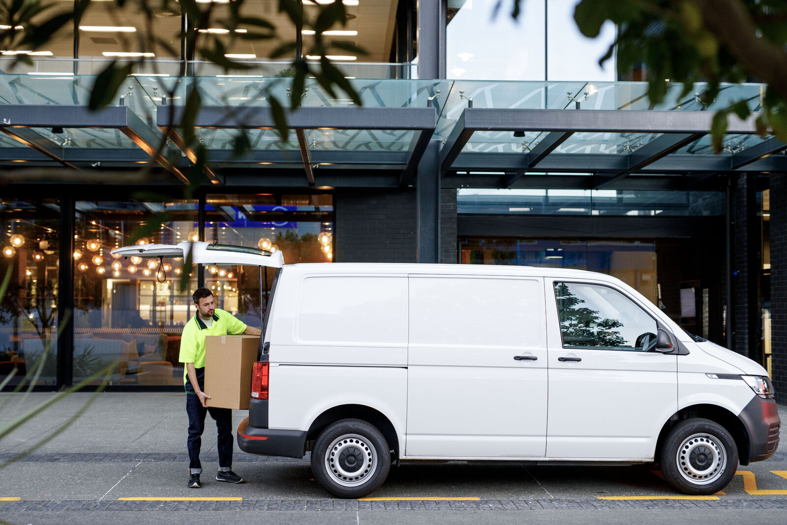 SGFleet_NZ_Delivery_1_Sept24-medium Delivery driver unloading a box from a commercial van in NZ city