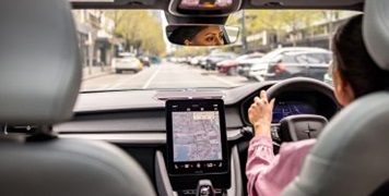 Woman driving a vehicle with GPS