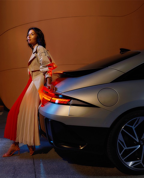image-of-hyundai-ionic-6-with-female-leaning-on-the-rear