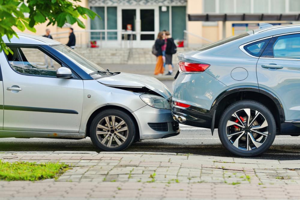 Fleet accidents Two vehicles involved in a front-end collision, showing damage from a fleet accident on the road