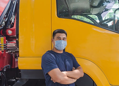 lorry driver with mask on