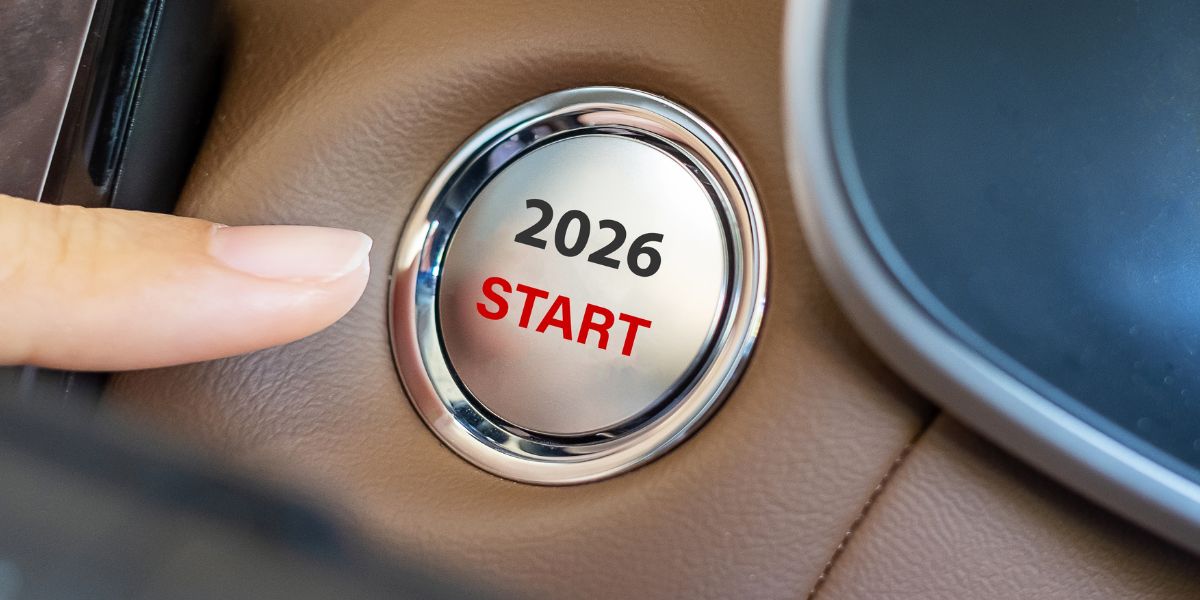 What the 2026 Autumn Budget means for UK fleets: A finger about to press a silver car ignition button labelled “2026 START” on a tan leather dashboard.