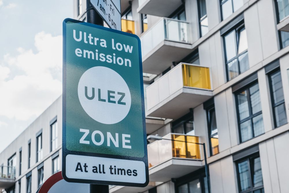 Which UK Clean Air Zones affect company fleets: A green and white ULEZ road sign reading